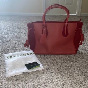 Exterior Material: Rust color red lather